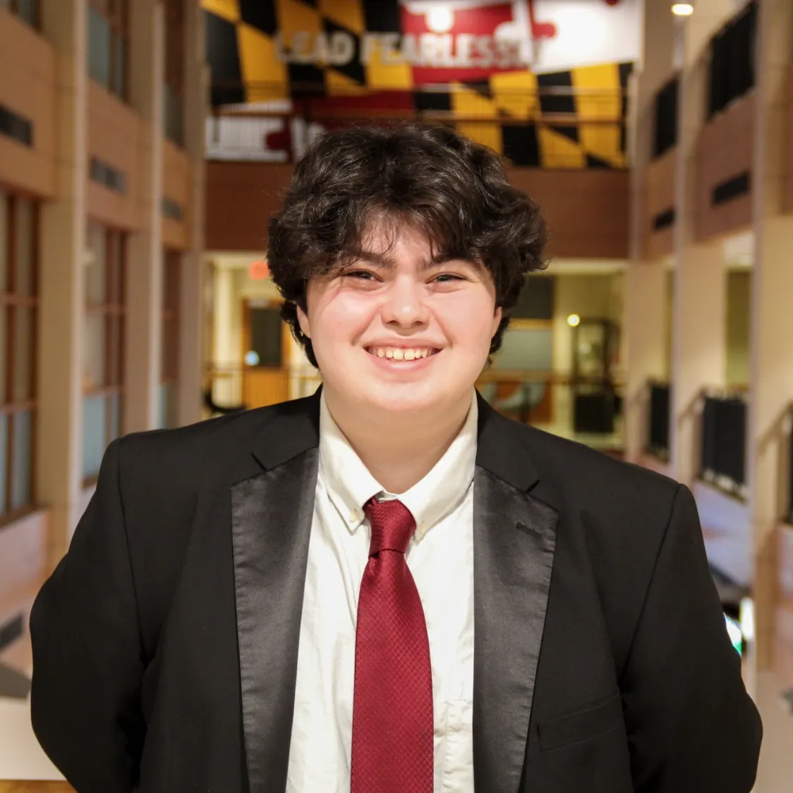 Alyssa Manchester smiling in Van Munching Hall at the University of Maryland.