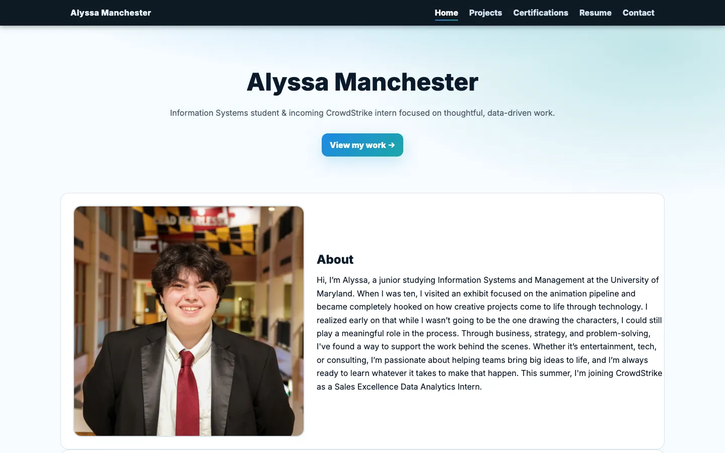 The previous Alyssa Manchester portfolio homepage with a light blue layout, portrait, organization ticker, and three project cards.